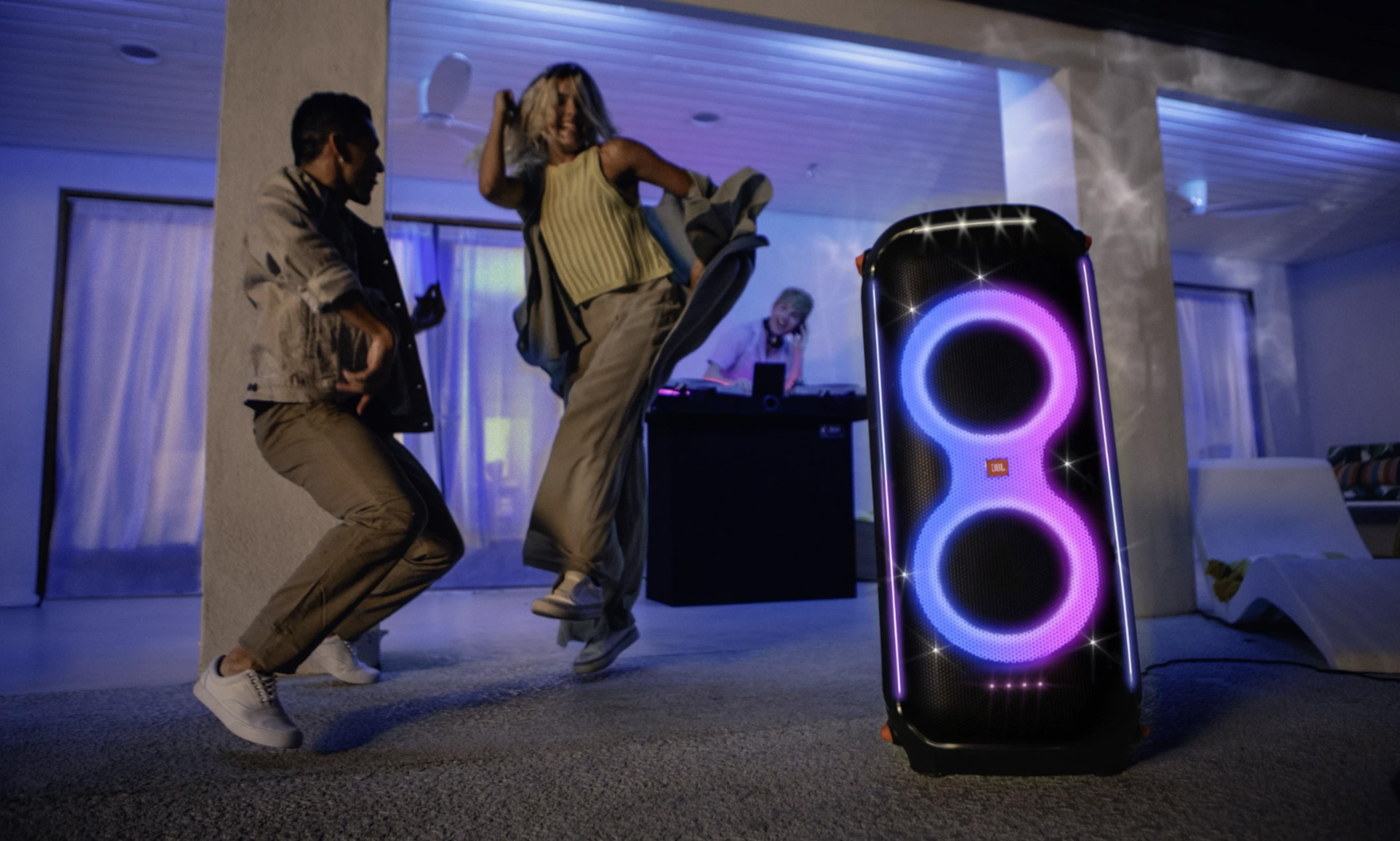 JBL Partybox 710 with some people dancing in front of it